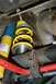 1997 Ford Crown Victoria - This image shows aftermarket suspension parts, including a yellow coilover and a red sway bar, mounted to a vehicle's chassis.