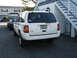 1997 Jeep Grand Cherokee - This 1997 Jeep Grand Cherokee is parked in front of a building with blue stairs.