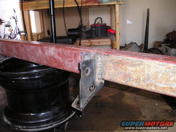 Red metal bumper part with mounting bracket