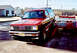 1989 Chevrolet S10 - This red SUV is on a trailer ramp, with a Confederate flag emblem on its front grille.