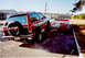 1989 Chevrolet S10 - A red 1989 Chevrolet S10 Blazer is shown from the rear as it is loaded onto a trailer.