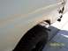 1978 Ford Bronco - Rust is visible on the rear wheel well of this white vehicle, dated 2004/01/04.