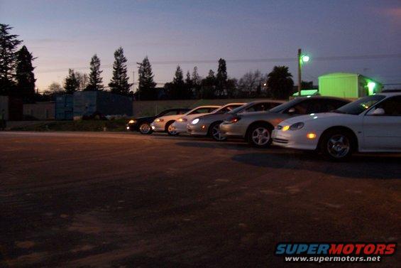 White 1998 Mercury Sable parked in a line of cars