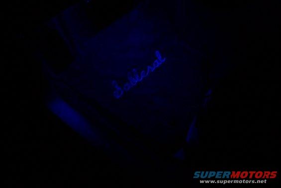 Blue illuminated 'Sable' script on a dark surface