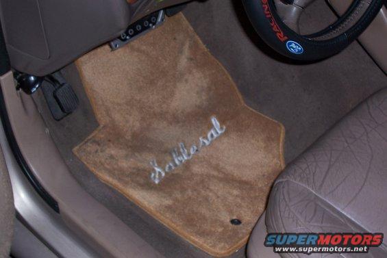Tan floor mat with embroidered "Sablesal" text in a car interior