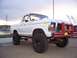 1978 Ford Bronco - This lifted 1978 Ford Bronco features a prominent red bull bar with KC lights, suggesting off-road modifications.