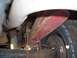 1978 Ford Bronco - This image shows the rear suspension components of a vehicle, including a leaf spring and tire.