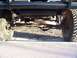 1978 Ford Bronco - Front view of a 1978 Ford Bronco's suspension and steering system.
