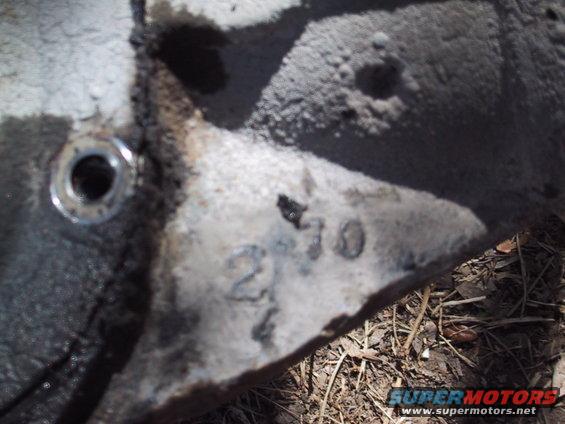 Close-up of a metal part with casting numbers '2 70' visible