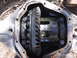1990 Ford Bronco - Close-up view of a vehicle's differential, revealing its internal gears and housing.