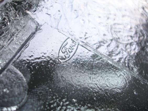 Ford emblem embossed on a dark, textured material