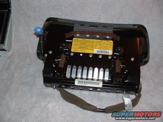 Airbag module with yellow warning label and barcode