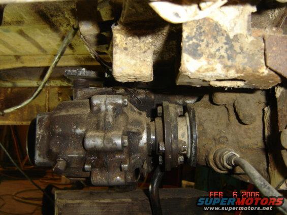Drivetrain component with rust and grime, viewed from below