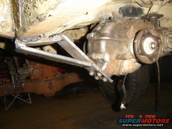 close-up of custom metal bracket welded to a vehicle's rear differential
