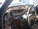 1986 Ford Bronco - The interior of a 1986 Ford Bronco shows a disassembled dashboard with numerous wires exposed.