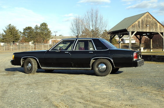 Black 1991 Ford Crown Victoria sedan, side view