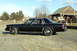 1991 Ford Crown Victoria - Side view of a black 1991 Ford Crown Victoria sedan parked outdoors.