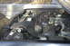 1991 Ford Crown Victoria - The engine compartment of a vehicle is shown with various mechanical parts and wiring.