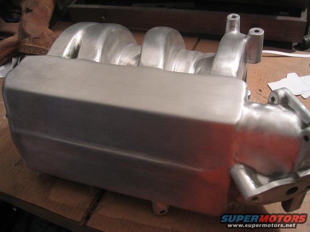 Aluminum intake manifold on a workbench