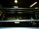 1989 Ford Bronco - Interior view of a vehicle's roll cage structure, obscuring most of the cabin.