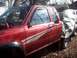 1995 Toyota Tacoma - This red 1995 Toyota Tacoma pickup truck features white racing stripes along its side.
