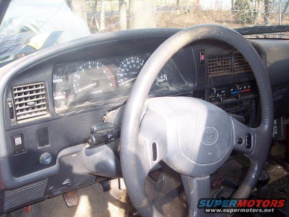 1995 Toyota Tacoma interior dashboard with steering wheel and gauges visible
