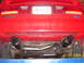 1994 Ford Probe - The rear of a red 1994 Ford Probe is shown, highlighting its dual exhaust system and license plate.