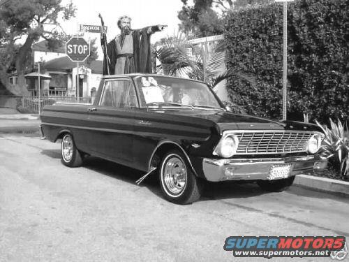 Black 1960 Ford Falcon Ranchero pickup truck with chrome grille and whitewall tires