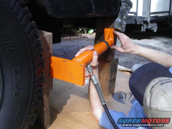Jim holding the Hydraulic Jack in place while Im supposed to be pumping it, but instead Im taking pictures.