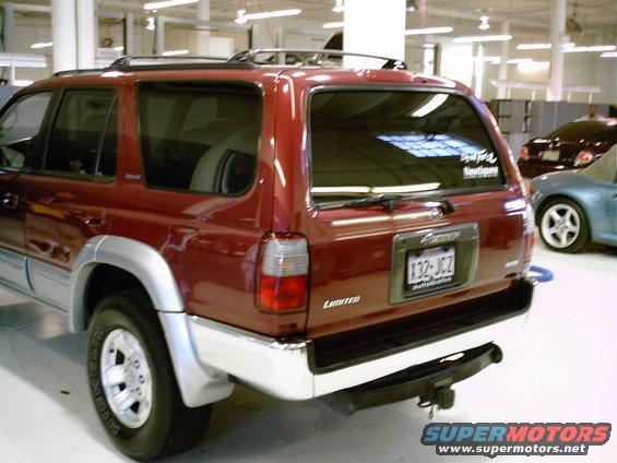 1996 Toyota 4Runner Limited in red, rear view. Another car is visible to the right