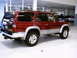 1996 Toyota 4Runner - A red SUV is parked indoors, showing its rear and side profile. The vehicle appears to be a 1996 Toyota 4Runner.