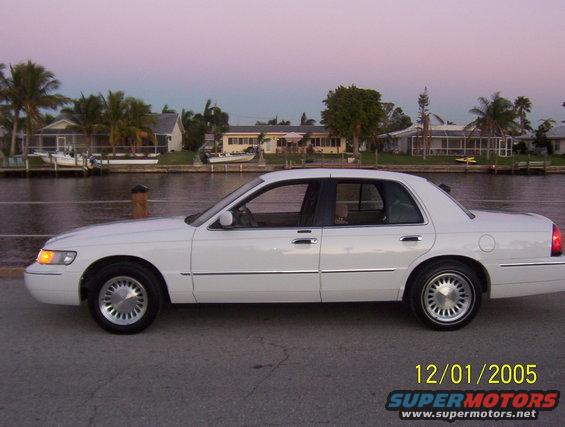 White 2001 Mercury Grand Marquis sedan, side view, clean condition