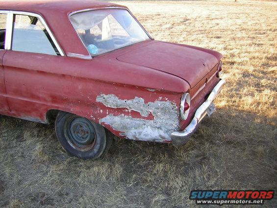 1963 Ford Falcon rear quarter panel showing rust and body filler damage