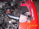 1994 Ford Probe - Aftermarket cold air intake installed in engine bay, with fuse box visible.