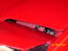 1994 Ford Probe - Close-up of a red car's engine bay, showing an aftermarket air filter.