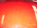 1994 Ford Probe - Close-up of a red car hood showing reflections and dust, with a date stamp of 02/09/2006.