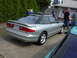 1996 Ford Probe - A silver 1996 Ford Probe is seen from a three-quarter front angle, parked next to other vehicles.