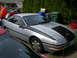 1996 Ford Probe - This 1996 Ford Probe is parked in a driveway with other vehicles present.