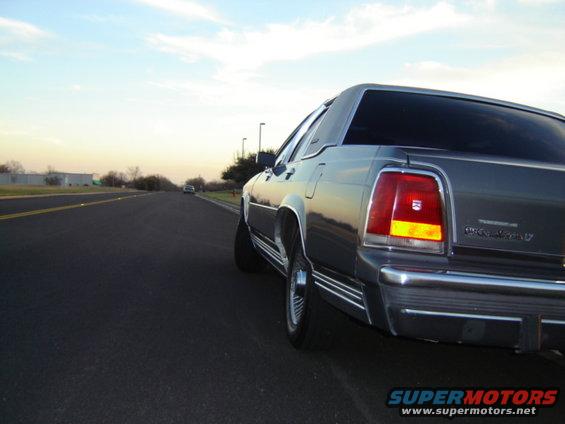 Gray 1988 Ford Crown Victoria LTD rear quarter view on a road