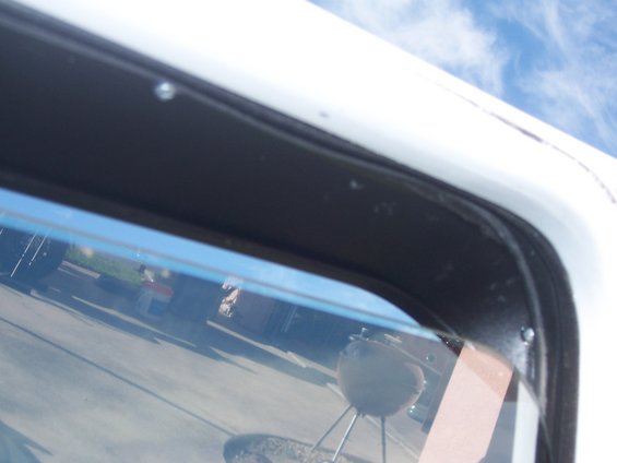 window-visors-004.jpg 2 more mounting screws, 4 required each visor