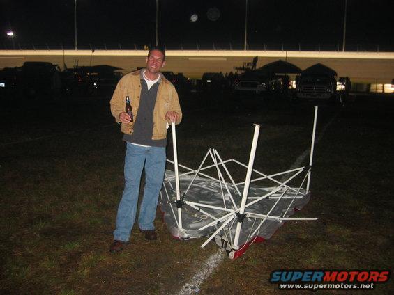 img_1393.jpg Trey and the (finally) destroyed NASCAR shelter.
