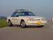 1993 Ford Mustang - A 1993 Ford Mustang police car is seen from a three-quarter front angle on a clear day.