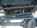 1994 Jeep YJ - Close-up view of the undercarriage, focusing on the steering and suspension systems.