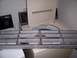 2004 Aston Martin Virage - A car grille is shown in front of a washing machine.