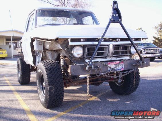 Front view of a heavily modified pickup truck with a custom bumper and tow bar. License plate reads F 72188