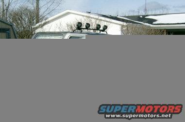 Gray SUV with roof light bar, front view