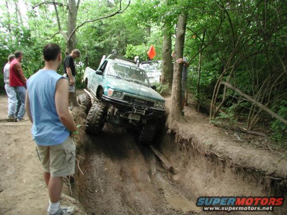 1989 Toyota Tacoma off-roading, front 3/4 view, green