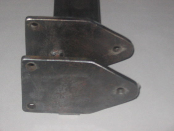 Two metal brackets bolted together