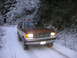 1987 Ford Bronco - A 1987 Ford Bronco navigates a snow-covered forest road.