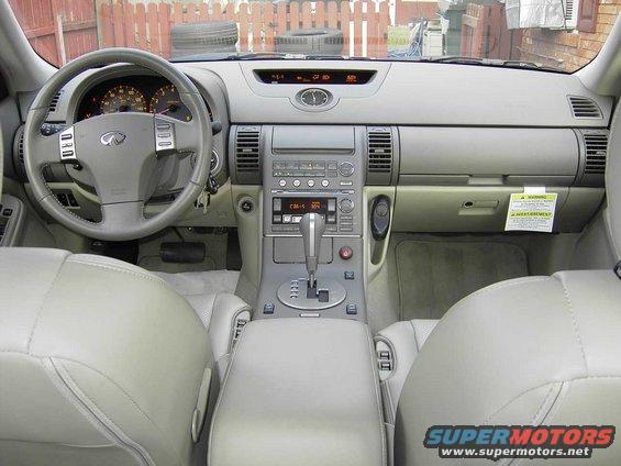2004 Infiniti G35 interior showing dashboard, steering wheel, center console, and seats